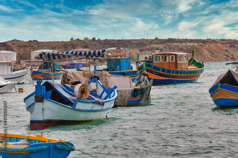 Marsaxlokk harbor with multicoloured boats Malta