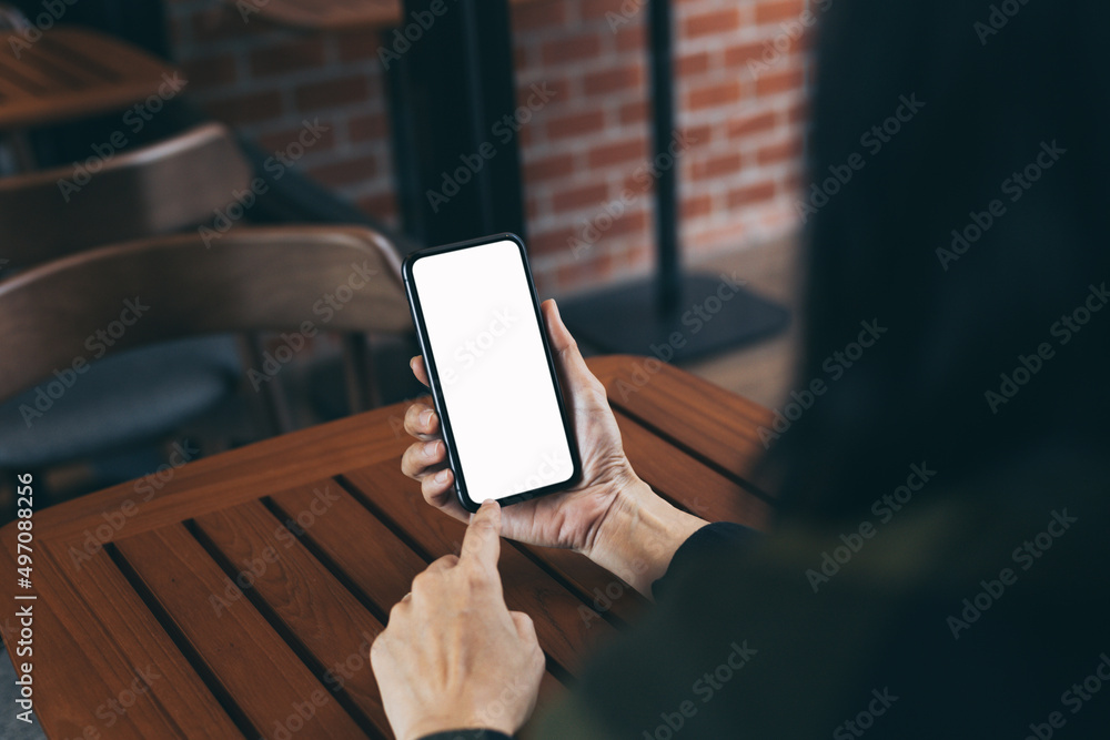 cell phone blank white screen mockup.hand holding texting using mobile on desk at office.background empty space for advertise.work people contact marketing business,technology cell phone blank white screen mockup.hand holding texting using mobile on desk at office.background empty space for advertise.work people contact marketing business,technology