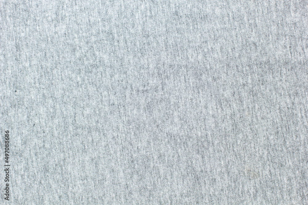 Grey knitted fabric cotton textured background. Closeup with copy space for your design Grey knitted fabric cotton textured background. Closeup with copy space for your design