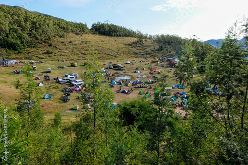 The popular landmark of Mt Ramelau with hundreds of colourful tents of walkers and hikers on a pilgrimage up the mountain in the districts of Timor Leste, Southeast Asia  photo