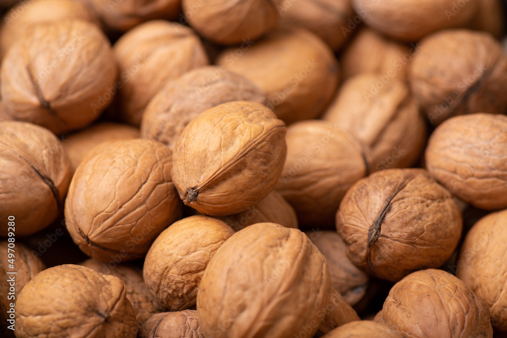 Background of walnuts. Dried walnuts in shell Background of walnuts. Dried walnuts in shell