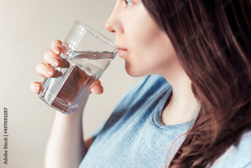 Woman drinks clean water. World Water Day. Health care concept. Diet and detox, increase metabolism. Woman drinks clean water. World Water Day. Health care concept. Diet and detox, increase metabolism.