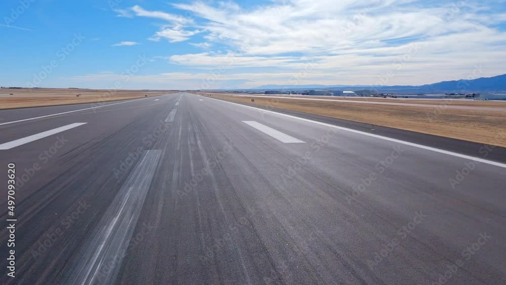 Airplane view taking off from the Colorado Springs Airport runway to the south Airplane view taking off from the Colorado Springs Airport runway to the south