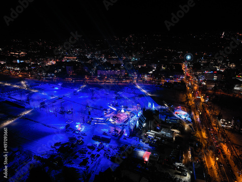 Fototapeta Naklejka Na Ścianę i Meble -  Aerial night view of New Year's Eve preparations in the city of Zakopane in Poland