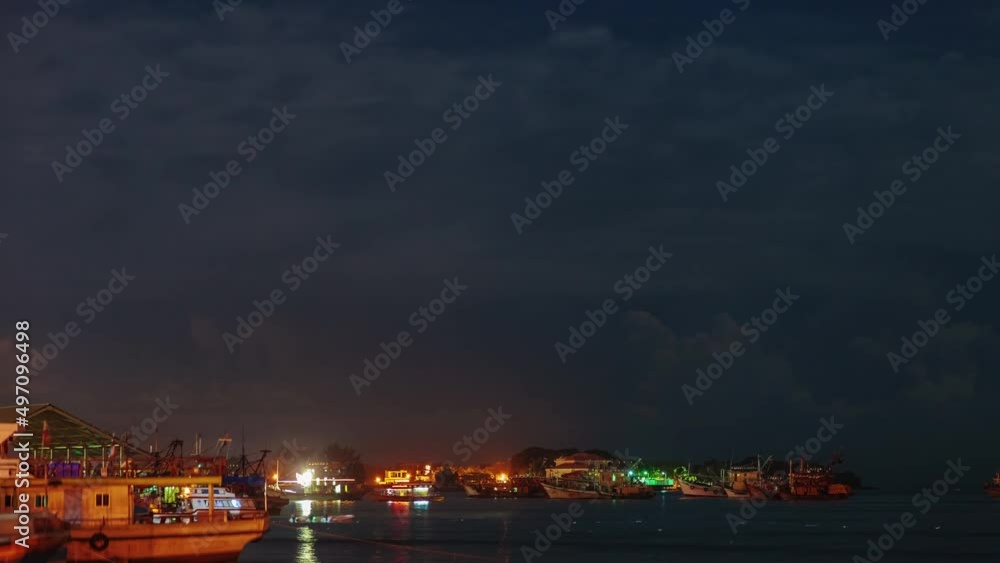 Thunderstorm, lightning and city pier with boats Thunderstorm, lightning and city pier with boats