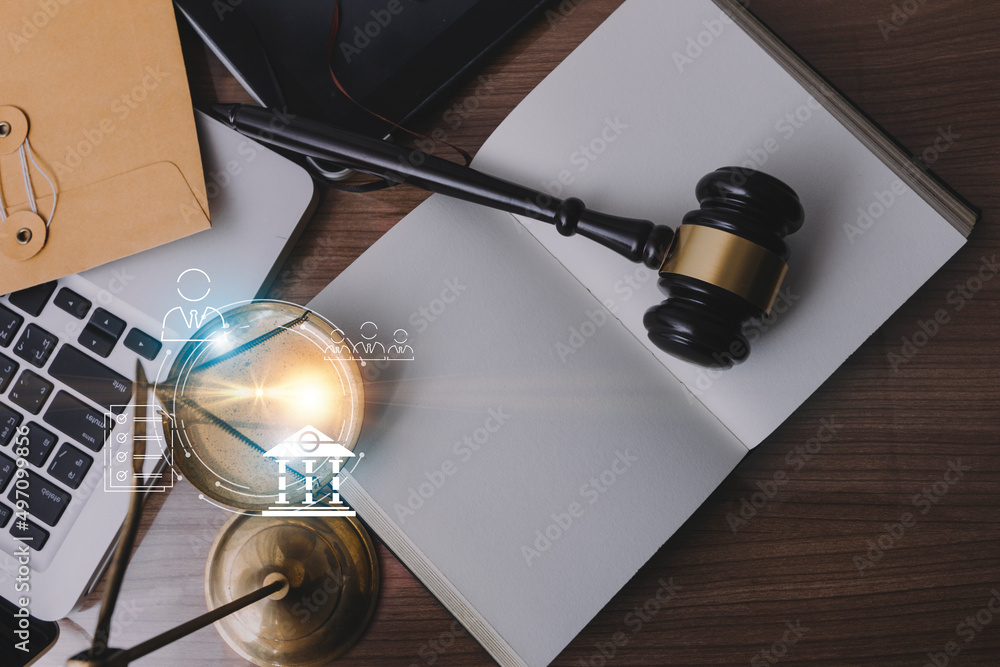 Male lawyer working with contract papers and wooden gavel on tabel in courtroom. justice and law ,attorney, court judge, concept. Male lawyer working with contract papers and wooden gavel on tabel in courtroom. justice and law ,attorney, court judge, concept.