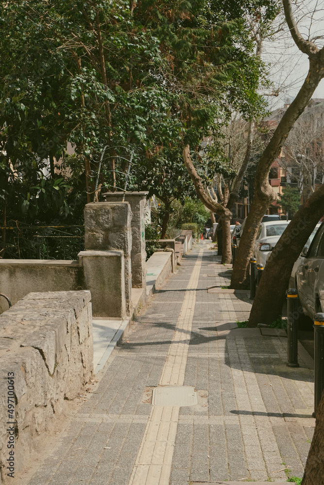 stone path in the city near cars parking. street view and middle east urbanism concept