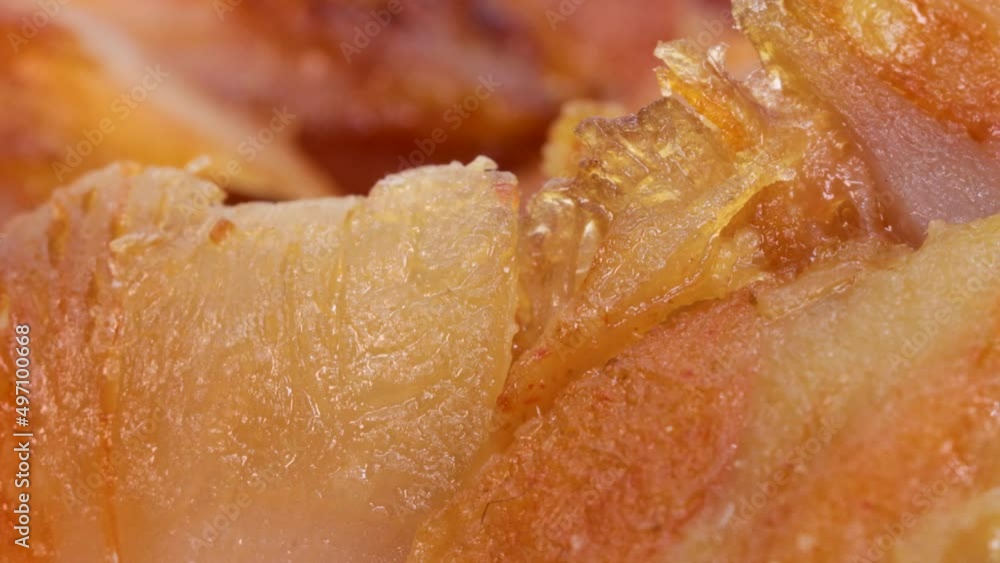 Close up view of unhealthy kebab meat fast food. Shawarma meat pieces, close up view in rotating motion. Close up view of unhealthy kebab meat fast food. Shawarma meat pieces, close up view in rotating motion.