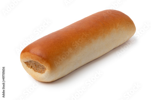 Single fresh baked sausage roll close up for a snack isolated on white background photo
