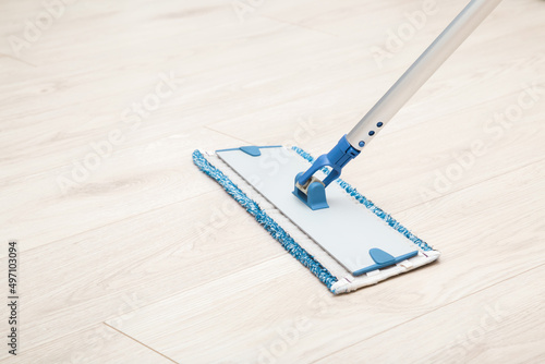 Tableau sur toile Microfiber mop pad with stick on light laminate background