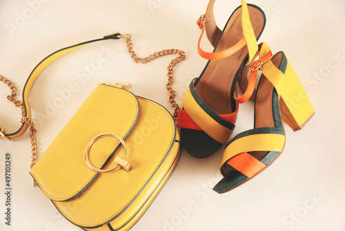 woman shoes with bag on white table