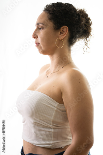 Young brunette woman backlit in profile