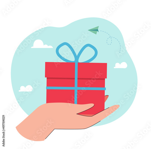 Human hand giving surprise gift. Person holding wrapped box with ribbon and bow flat vector illustration. Delivery of orders, bonus, reward concept for banner, website design or landing web page