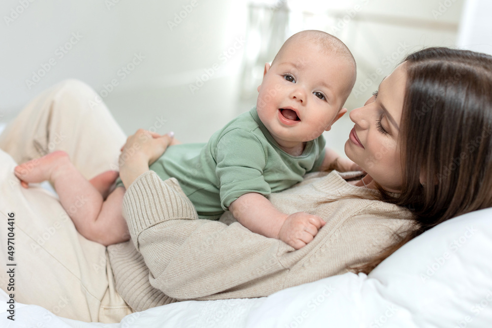 A woman with a small child. Mom with a baby. High quality photo A woman with a small child. Mom with a baby. High quality photo