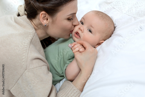 A woman with a small child. Mom with a baby. High quality photo