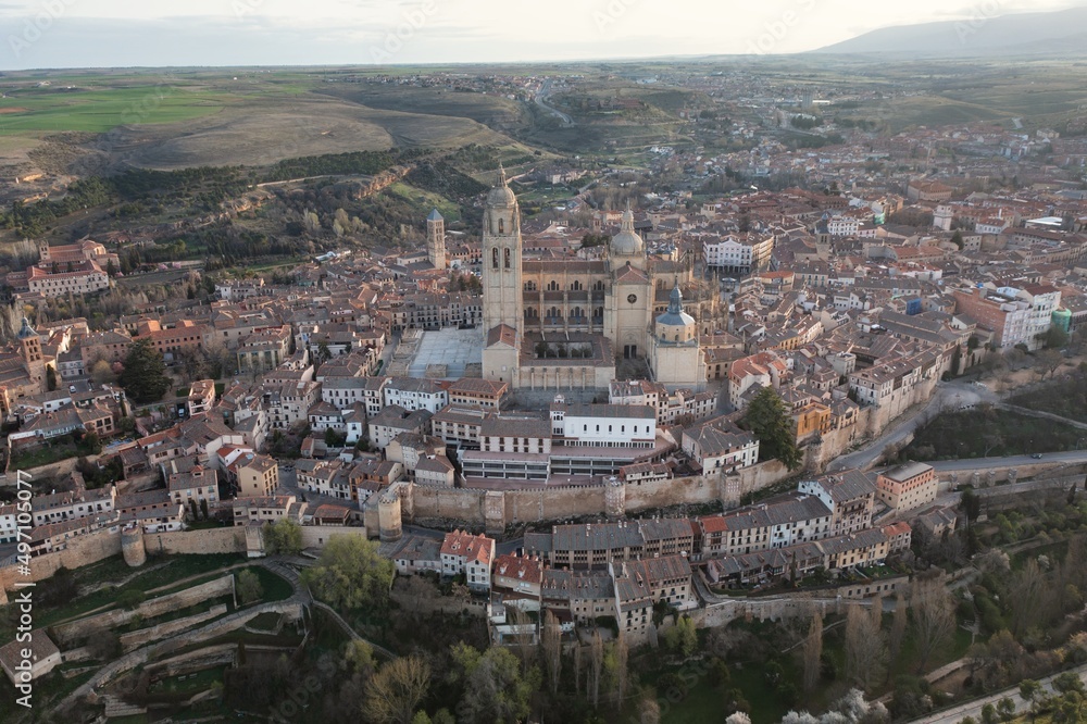 Segovia Cathedral aerial panorama view at sunrise in Spain. View over the town with its cathedral and medieval walls. Beautiful sunny day. Unesco world heritage site.