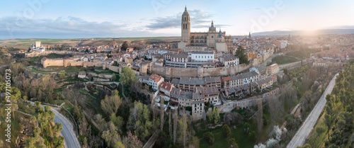 Segovia Cathedral aerial panorama view at sunrise in Spain. View over the town with its cathedral and medieval walls. Beautiful sunny day. Unesco world heritage site.
