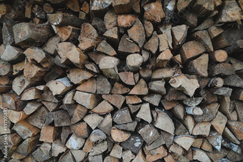 Close up stack of dry firewood oak wooden logs  chopped  split and organized in a pile for winter fuel stock