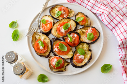 Baked eggplant with tomato, cheese and basil