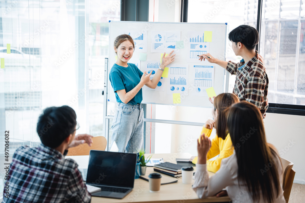 Successful business people present analytics reports while working with colleagues in the modern office. Successful business people present analytics reports while working with colleagues in the modern office.