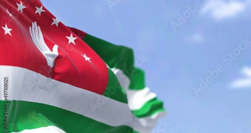 Tableau sur toile Detail of the national flag of Abkhazia waving in the wind on a clear day