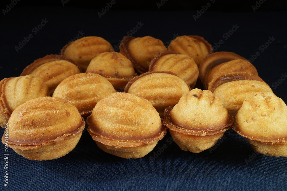Pastry nuts with filling on the table in the kitchen