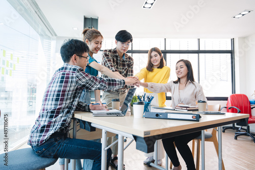 young business people putting their hands together. Stack of hands. Unity and teamwork concept.