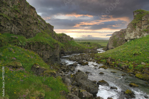 Stream flowing through moutains in Iceland