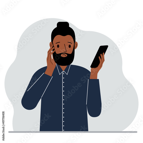 A man looks at a mobile phone. A man looks sadly at the phone he holds in his hand. Vector