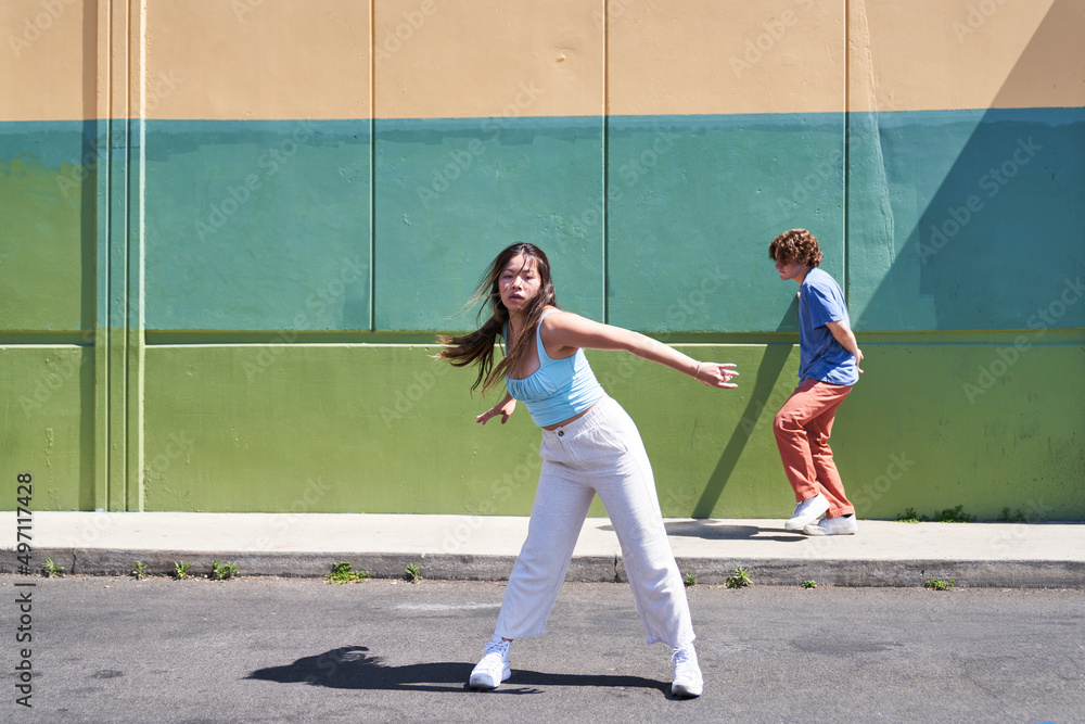 woman and man dancing by sidewalk woman and man dancing by sidewalk