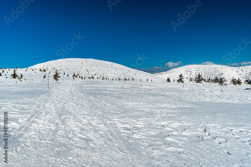 Winter Nizke Tatry mountains in Slovakia with snow covered hills and blue sky