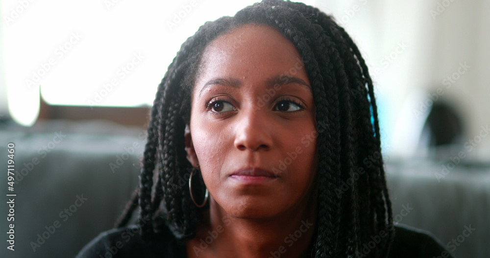 Pensive black teen girl thinking, Thoughtful African mixed race young woman Pensive black teen girl thinking, Thoughtful African mixed race young woman