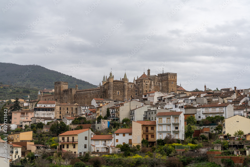 landscape view of the village of Guadalupe and the famous monastery and pilgrimage site under an overcast sky