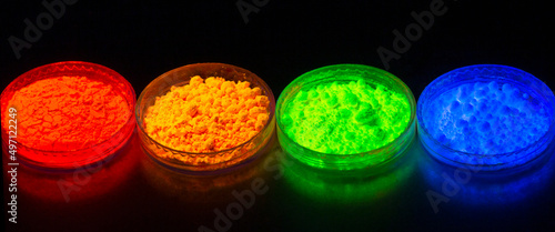 Fluorescent organic materials powder of red, yellow, green color for production OLED inside of glasses bottles in UV light.