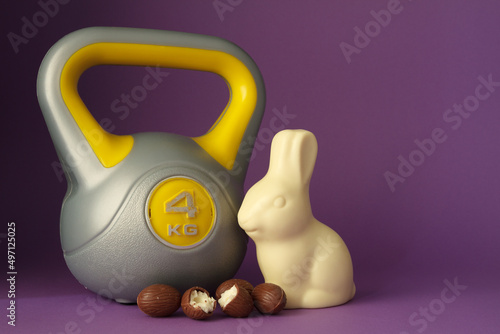 Canvas Print Kettlebell weight and chocolate Easter bunny
