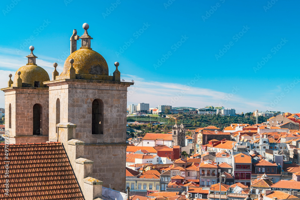 Portugal, Porto, Towers of Dos Grilos church and old town rooftops