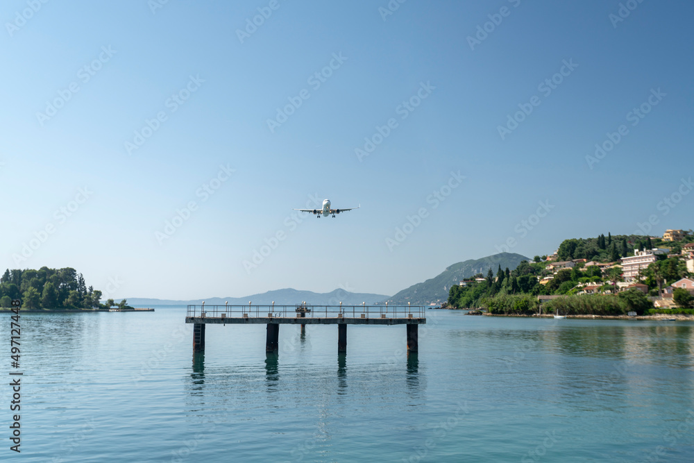 Greece, Corfu island, Airplane flying above sea
