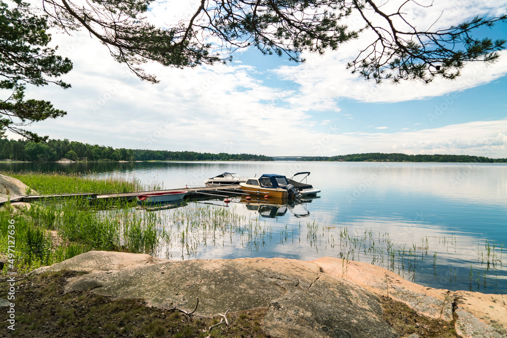 Sweden, Loftahammar, Boats moored at small pier on calm sea Sweden, Loftahammar, Boats moored at small pier on calm sea