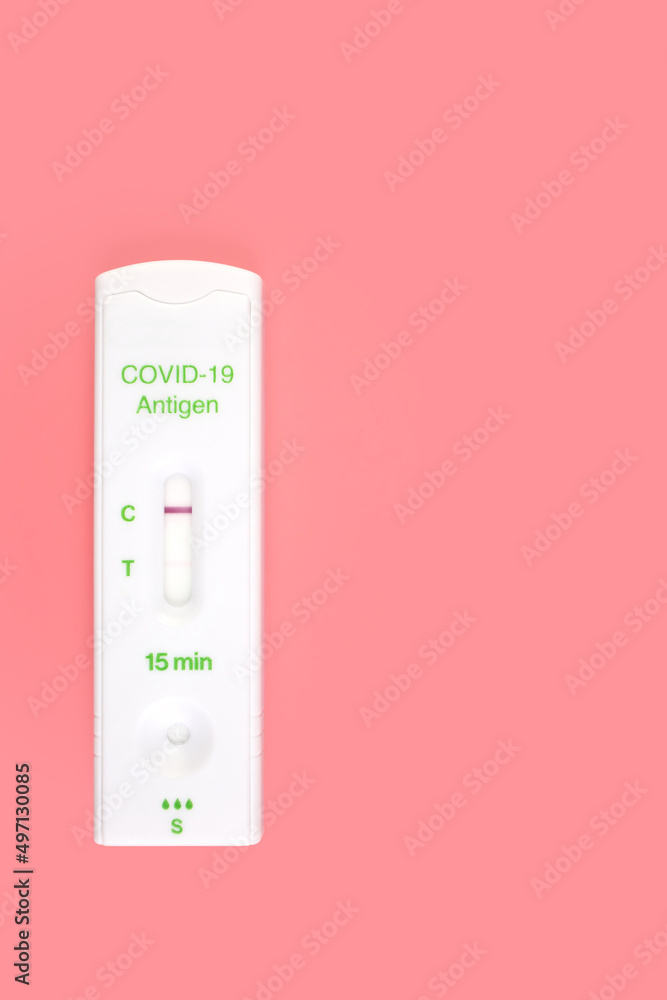 Rapid Antigen Covid Test Showing Faint Positive Result Isolated on a Pink Backgound Rapid Antigen Covid Test Showing Faint Positive Result Isolated on a Pink Backgound