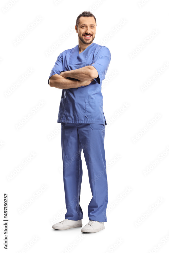 Full length shot of a young male healthcare worker in a blue uniform posing with crossed arms Full length shot of a young male healthcare worker in a blue uniform posing with crossed arms