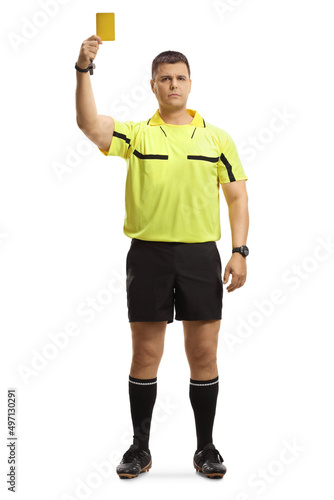 Photos Full length portrait of a football referee giving a yellow card