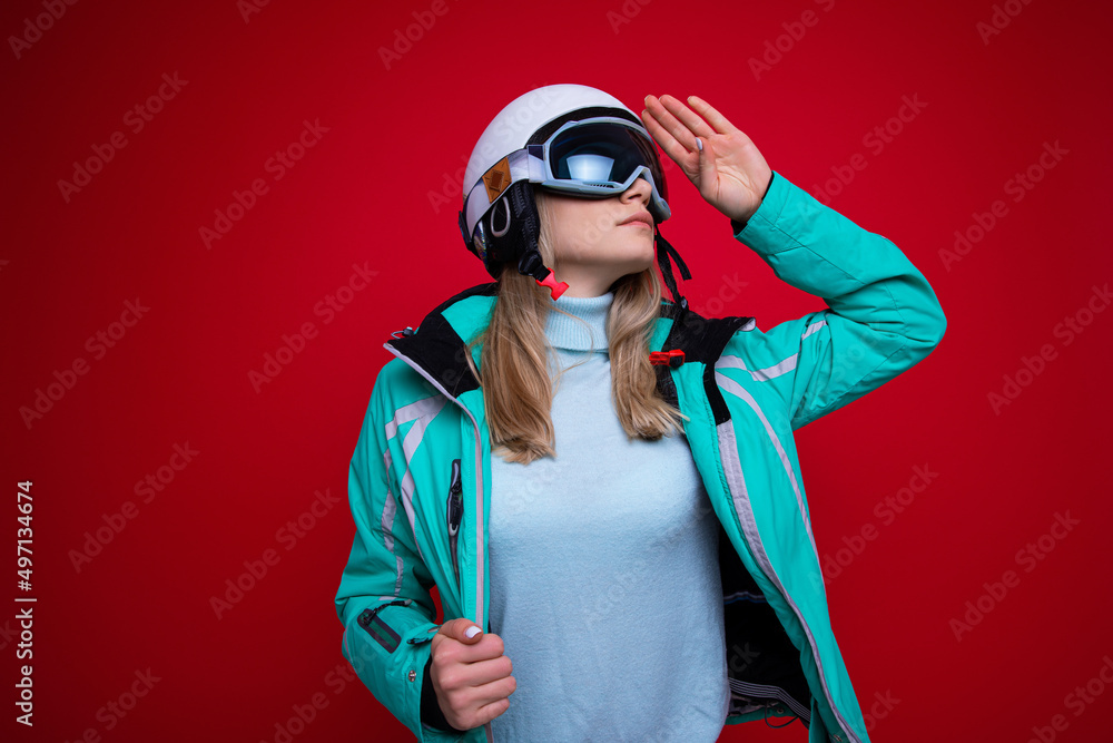 Portrait of a young woman in a ski helmet and glasses Portrait of a young woman in a ski helmet and glasses