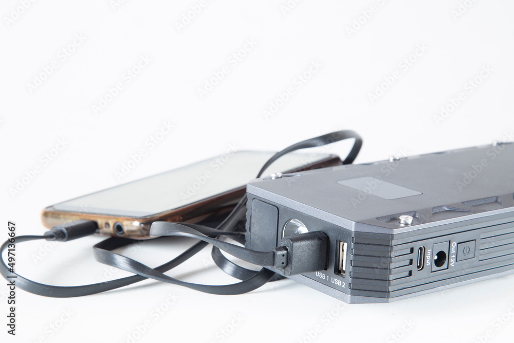 Power bank on a white background. An energy storage device for recharging phones and gadgets. Power bank on a white background. An energy storage device for recharging phones and gadgets.