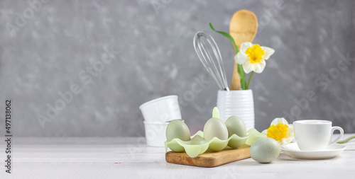 Kitchenware. Easter background. Easter. Flowers and eggs. Banner. copy space photo