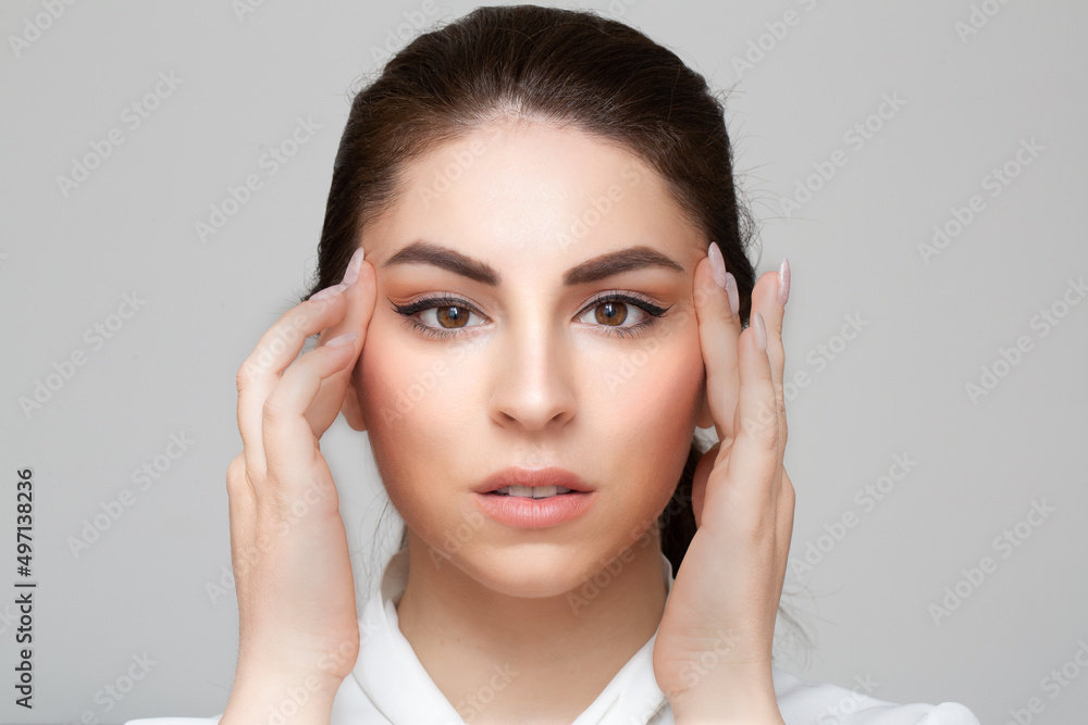 Female woman portrait getting a face massage to mitigate expression wrinkles Female woman portrait getting a face massage to mitigate expression wrinkles