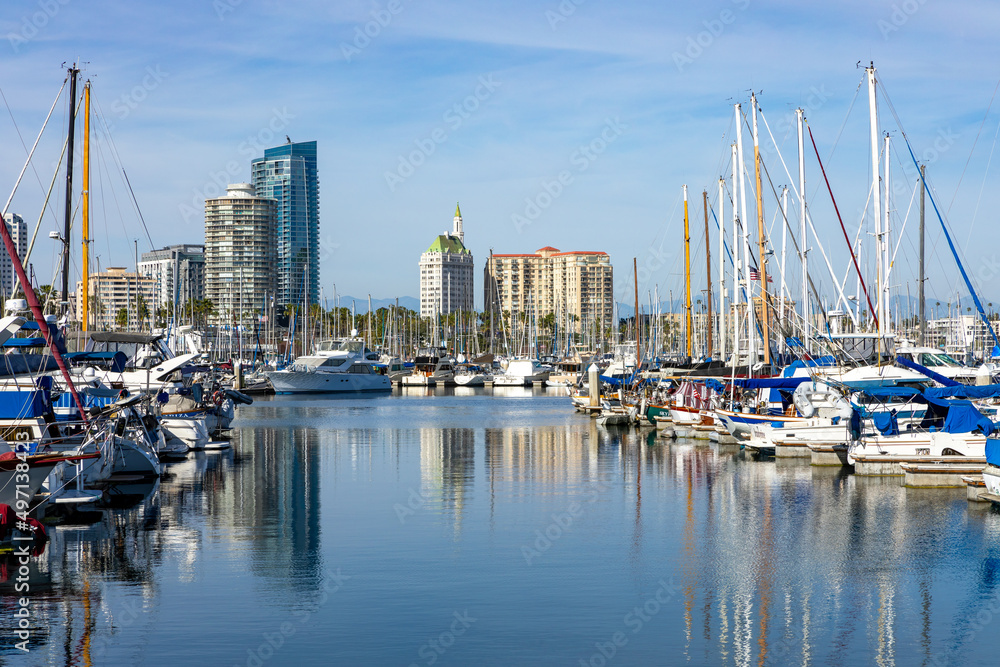 Shoreline Village in Rainbow Harbor In Long Beach, California. Shops line the edge of the marina area, and boats are docked in it's harbor.