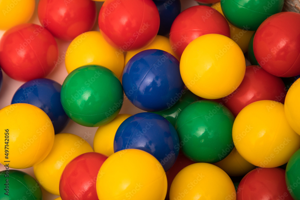 Multi-colored plastic balls. A children's balls isolated on white background. Multi-colored plastic balls. A children's balls isolated on white background.