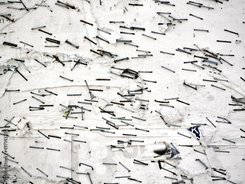 Old bulletin board with rests of paper and staples