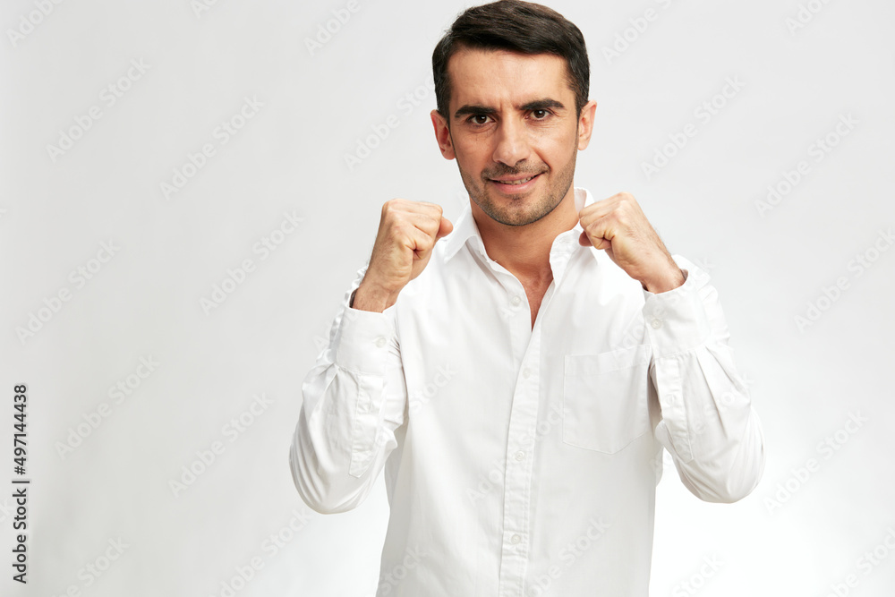 manager in white shirts holding fists in front of him copy-space isolated background manager in white shirts holding fists in front of him copy-space isolated background