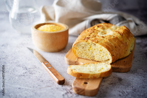 Corn wheat white bread with glasses of water